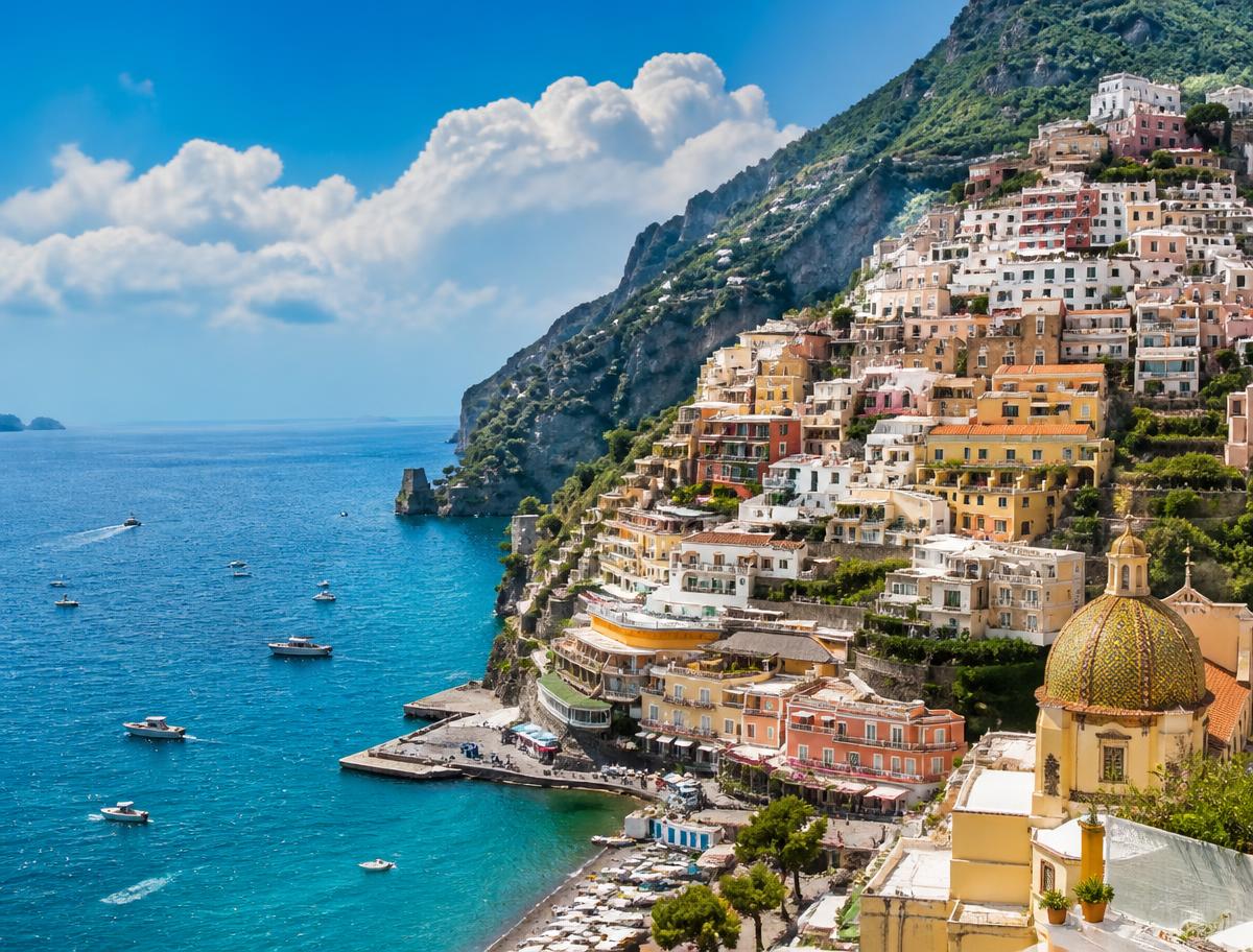 Boats moored below the cliffs of Capri on Italy's Amalfi Coast